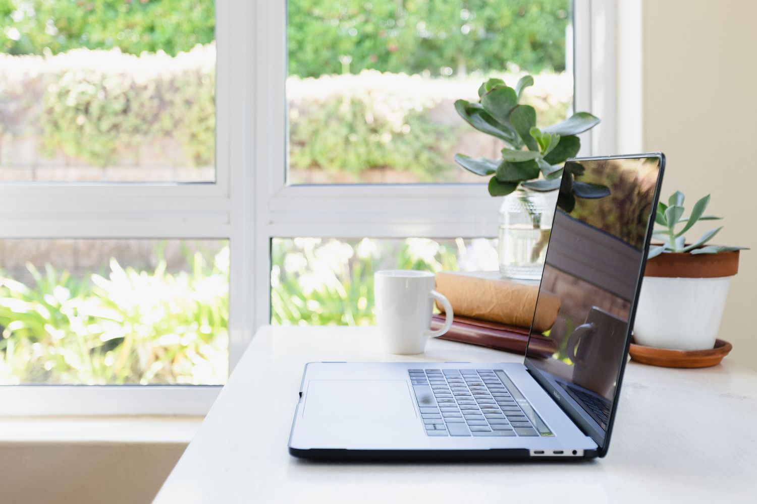 Illustrated home office room showing natural window light, desk lamp, and monitor placement for a comfortable visual environment